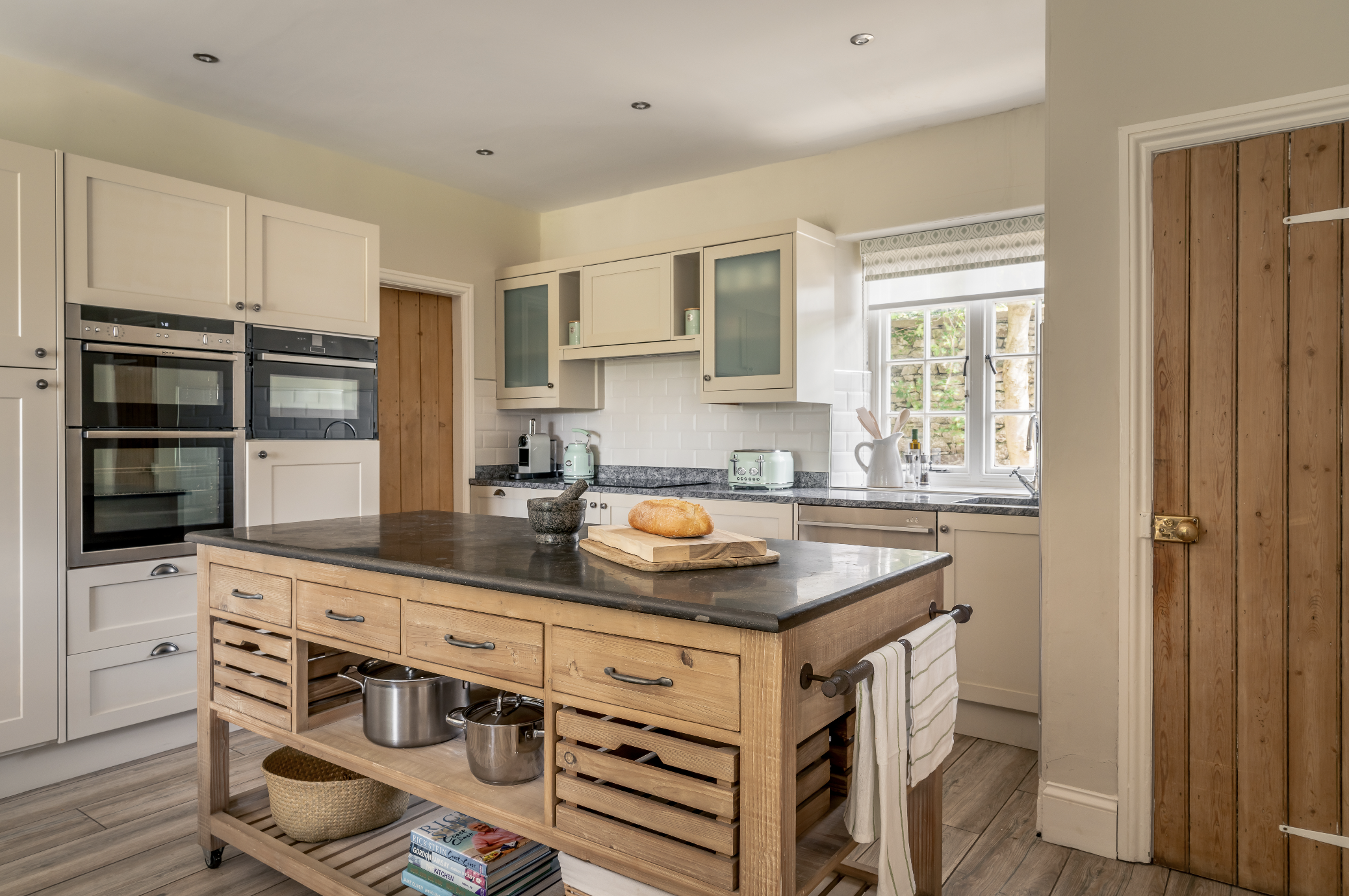 Luxury large holiday let with hot tub in Kirkby Lonsdale near the lake district and Yorkshire dales for special occasions and weddings - kitchen with island unit - downstairs bedroom